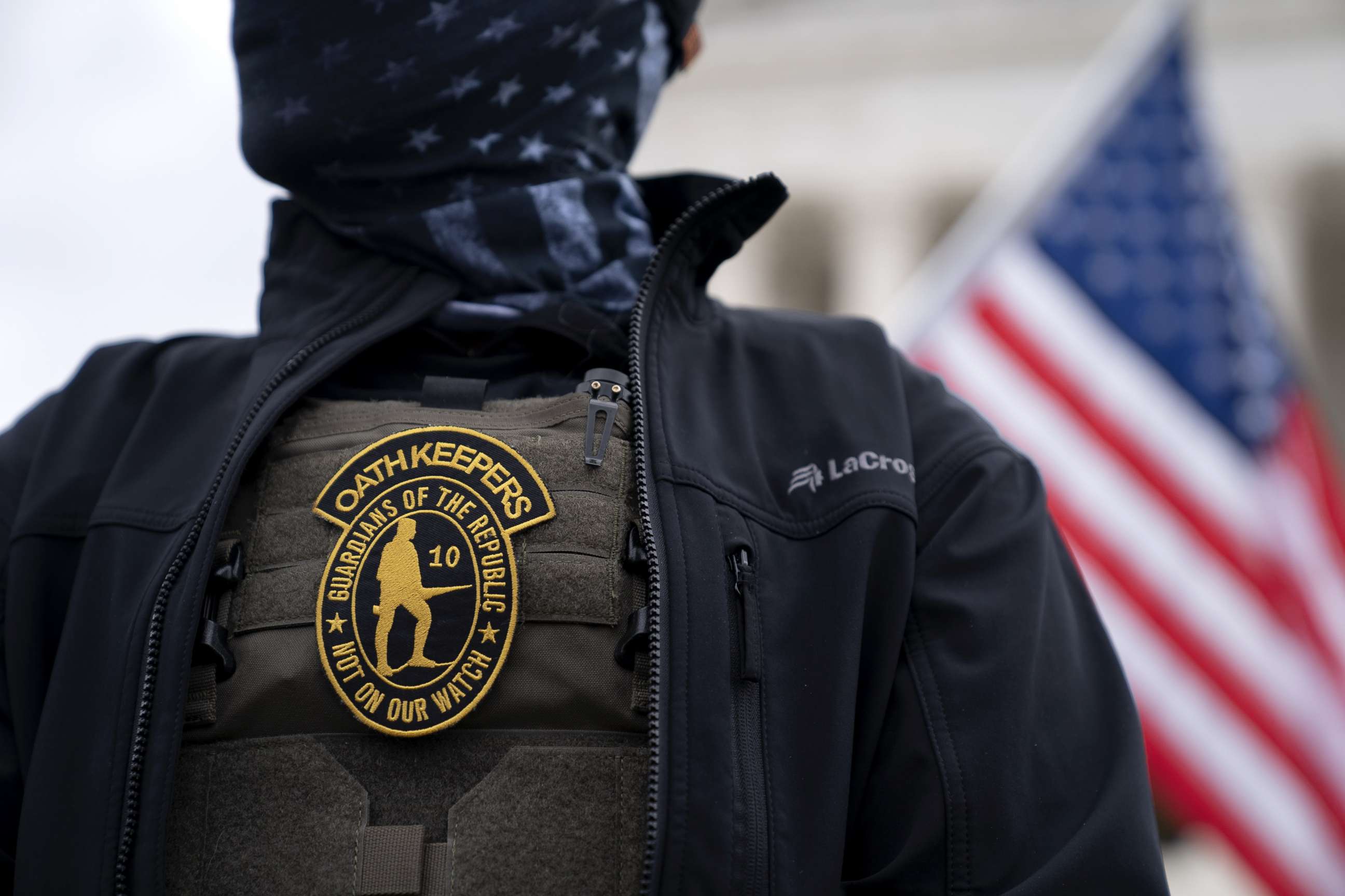 PHOTO: A demonstrator wears an Oath Keepers anti-government organization badge on a protective vest during a protest outside the Supreme Court in Washington, Jan. 5, 2021.