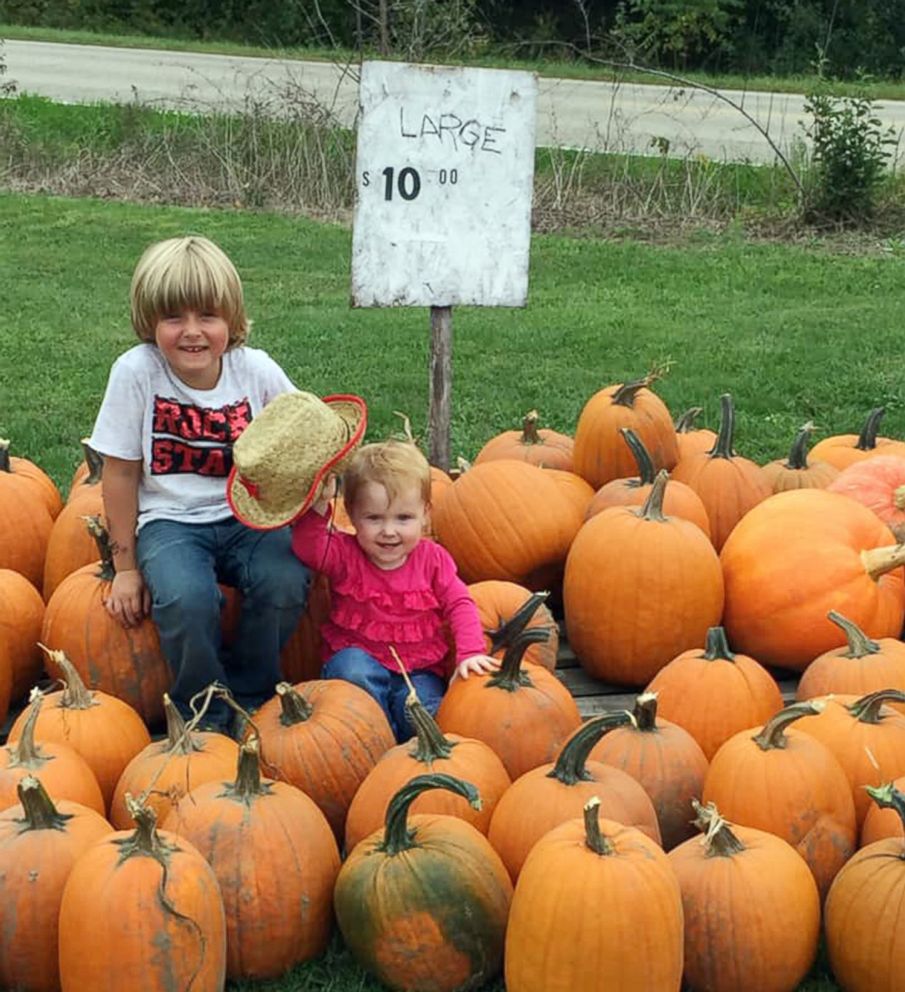 PHOTO: Ian Christensen, age 6, suffering from type 1 diabetes, poses for a photo with his younger sister while he is selling pumpkins in front of his home in Sand Lake, Michigan, in hopes of raise money to buy an alert dog who can help with his illness.
