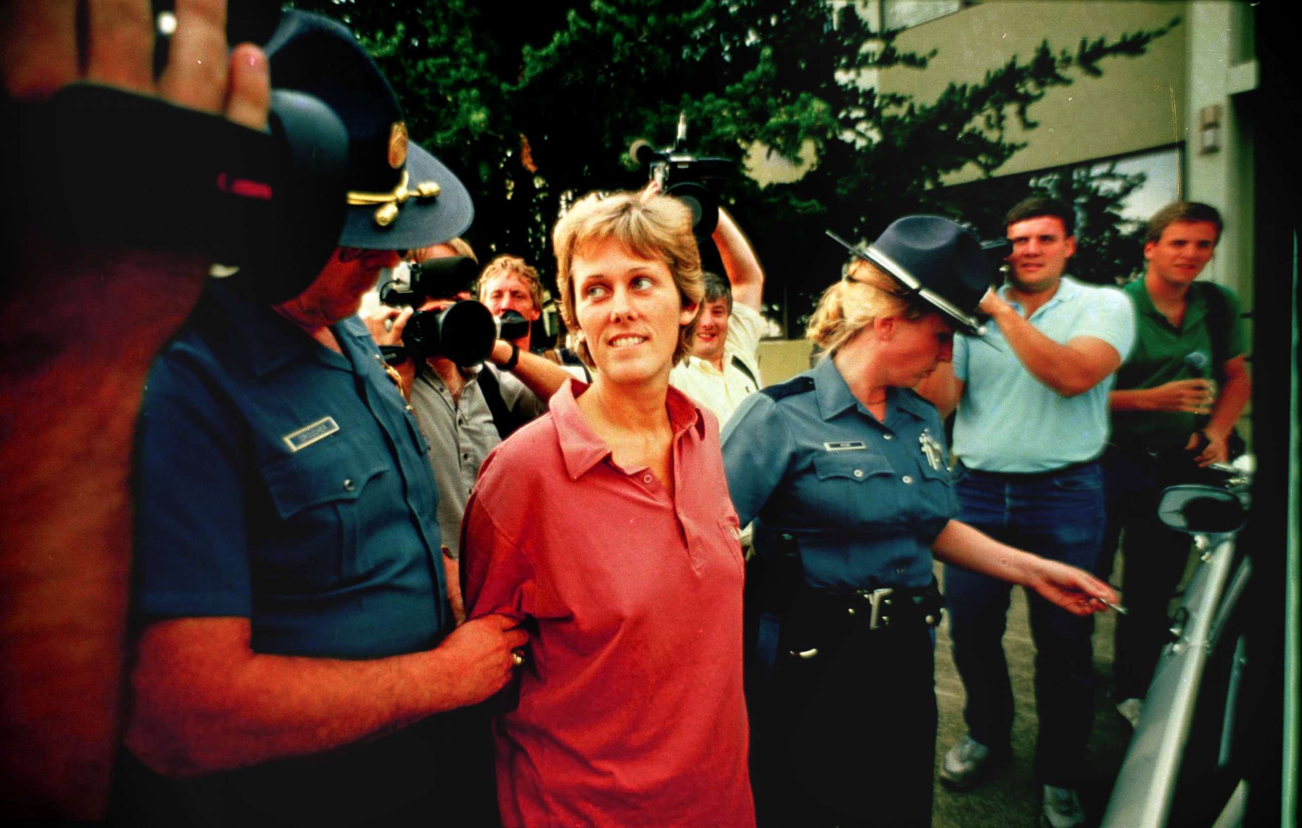 PHOTO: Elizabeth Diane Downs, the convicted childkiller who escaped July 11, 1987 from the women's prison in Salem, Ore., is escorted out of state police headquarters in Salem following  her capture July 21, 1987.