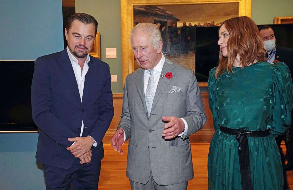PHOTO: Britain's Prince Charles, center, speaks with actor Leonardo DiCaprio, left, and designer Stella McCartney, right, while visiting a fashion installation by the McCartney, during the Cop26 summit in Glasgow, Scotland, Nov. 3, 2021.