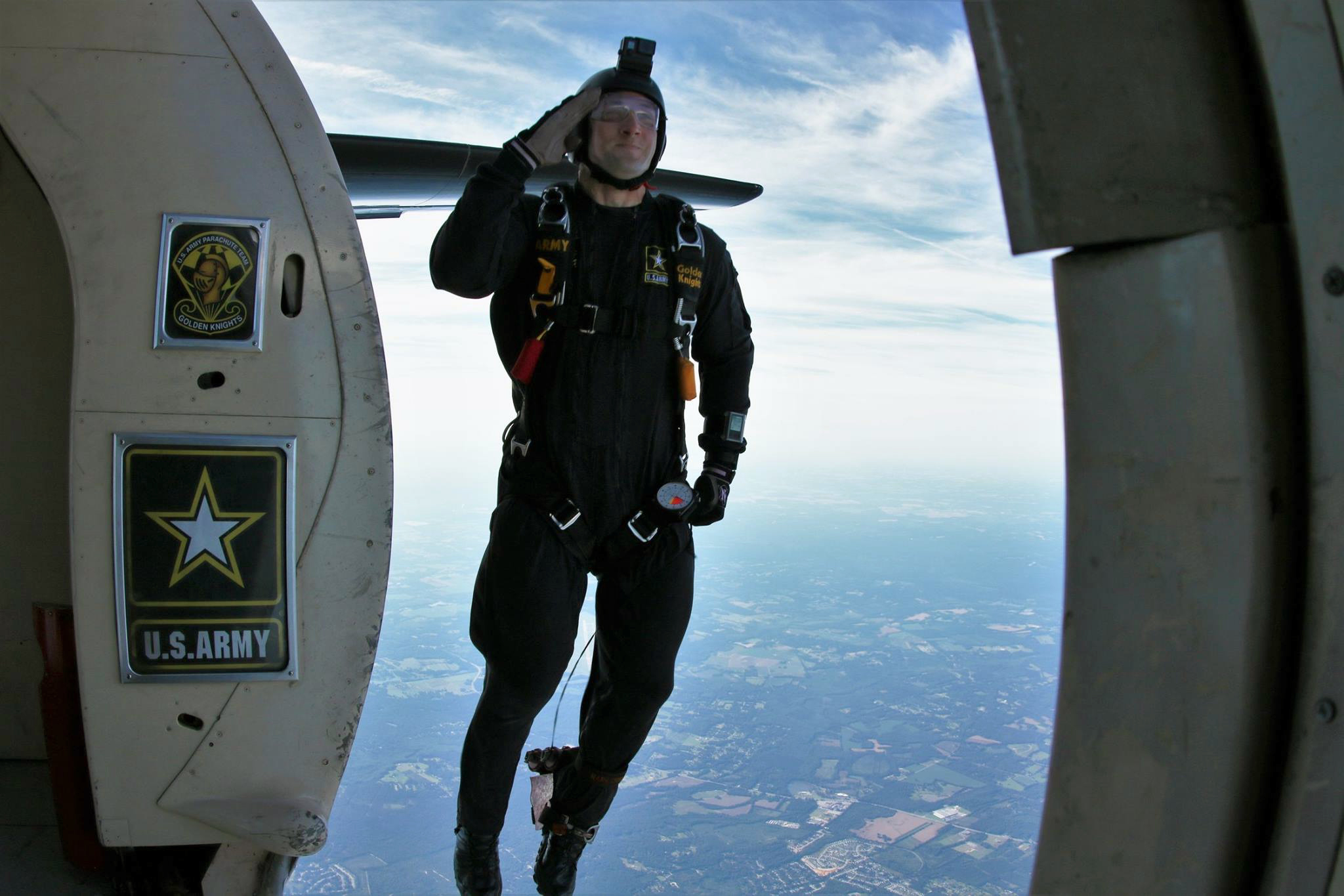 PHOTO: Sergeant First Class Dick Young jumps out of an airplane as part of his training with the Army's elite Golden Knights parachute team.