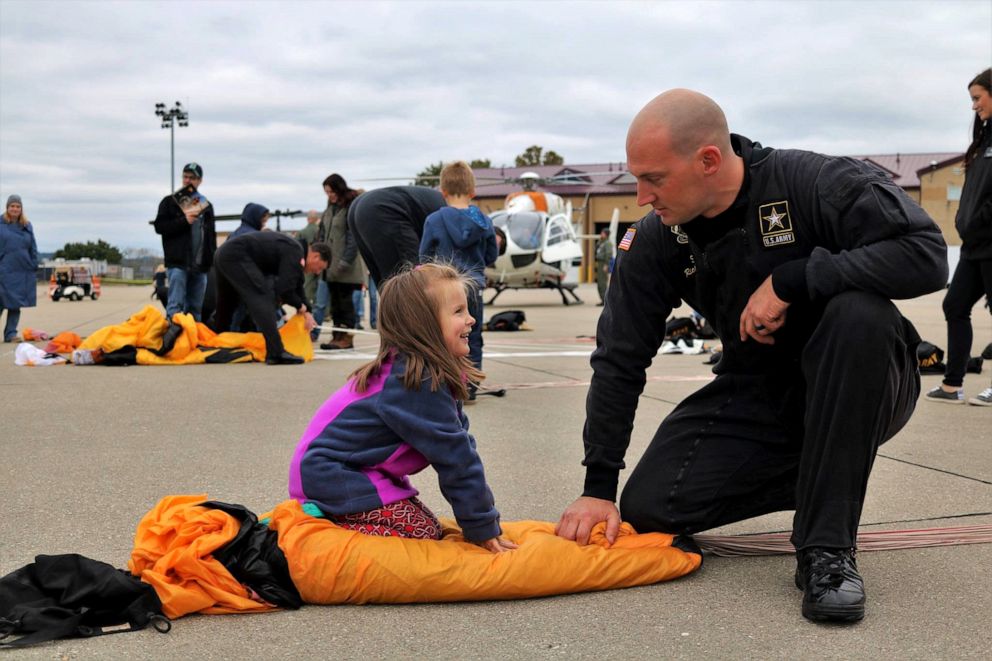 PHOTO: Golden Knight Sergeant First Class Dick Young with his daughter after a jump.