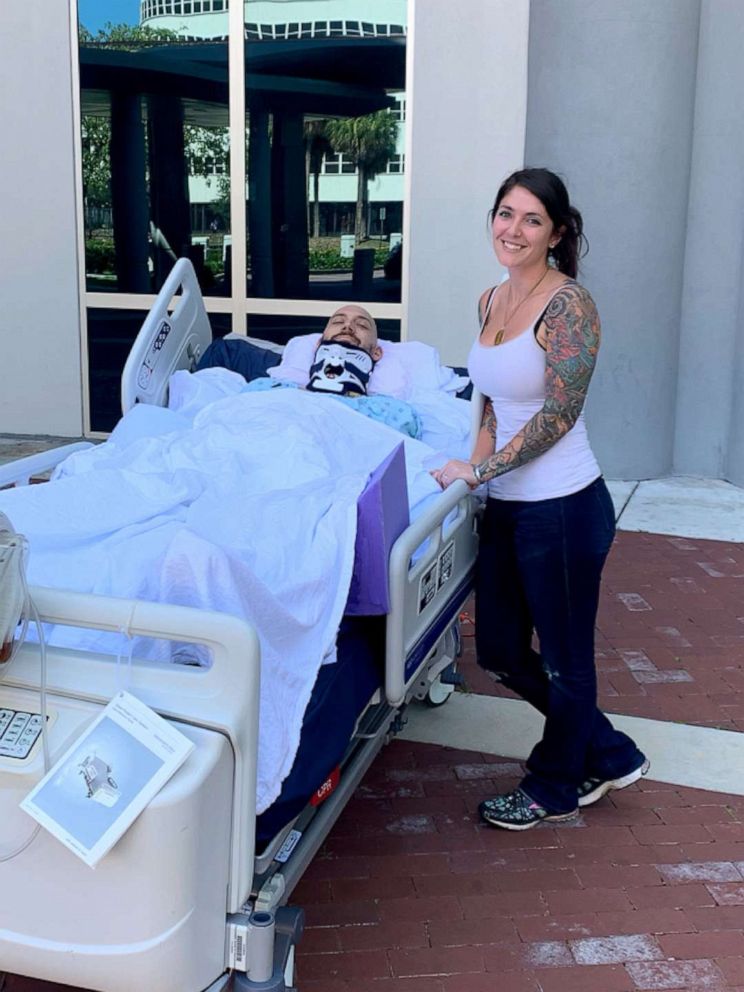 PHOTO: Golden Knight Sergeant First Class Dick Young with his wife, Trina, after he was injured during a night jump on February 12, 2019.