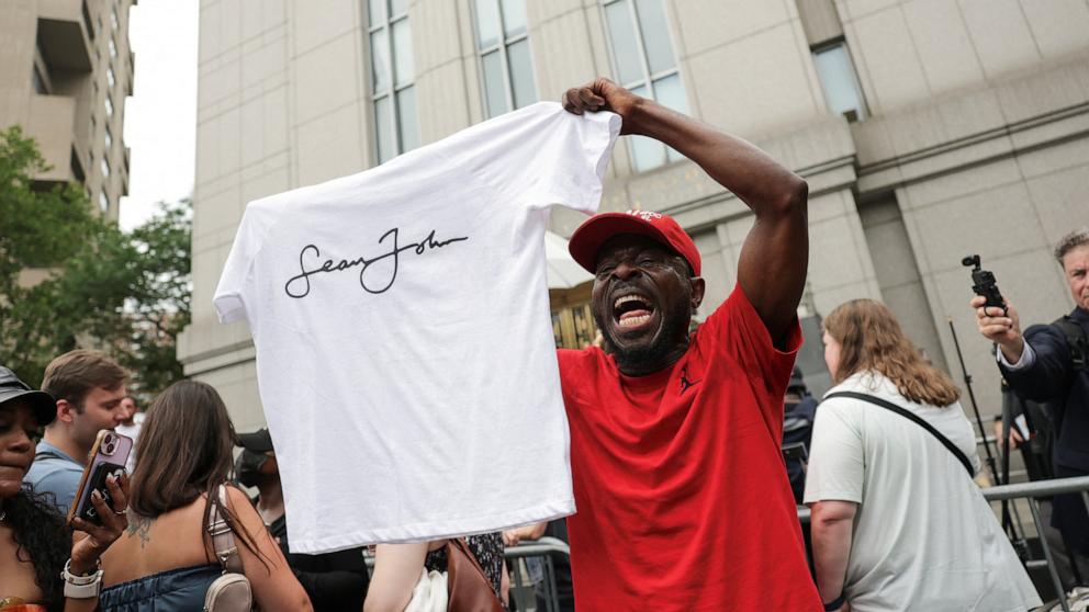 PHOTO: A man holding a Sean John T-shirt reacts outside the U.S. federal court, after the jury reached verdicts in the Sean "Diddy" Combs sex trafficking and racketeering conspiracy trial, in New York City, July 2, 2025.