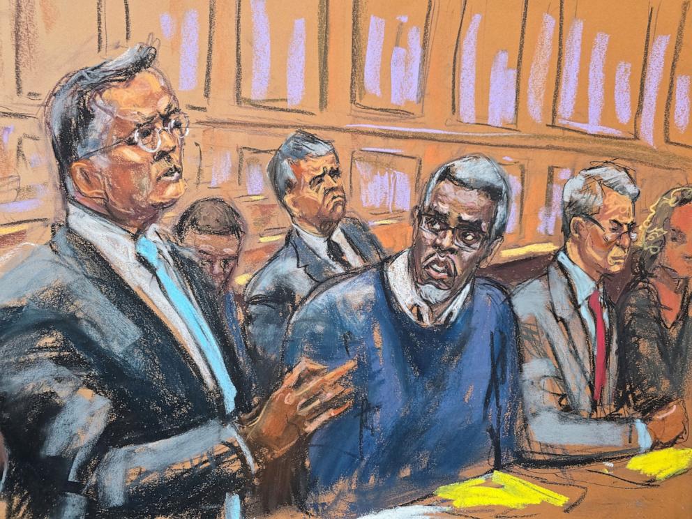 PHOTO: U.S. Marshals sit behind Sean "Diddy" Combs as he sits at the defense table alongside lawyers Marc Agnifilo and Brian Steel in the courtroom during his sex trafficking trial in New York City, May 9, 2025.