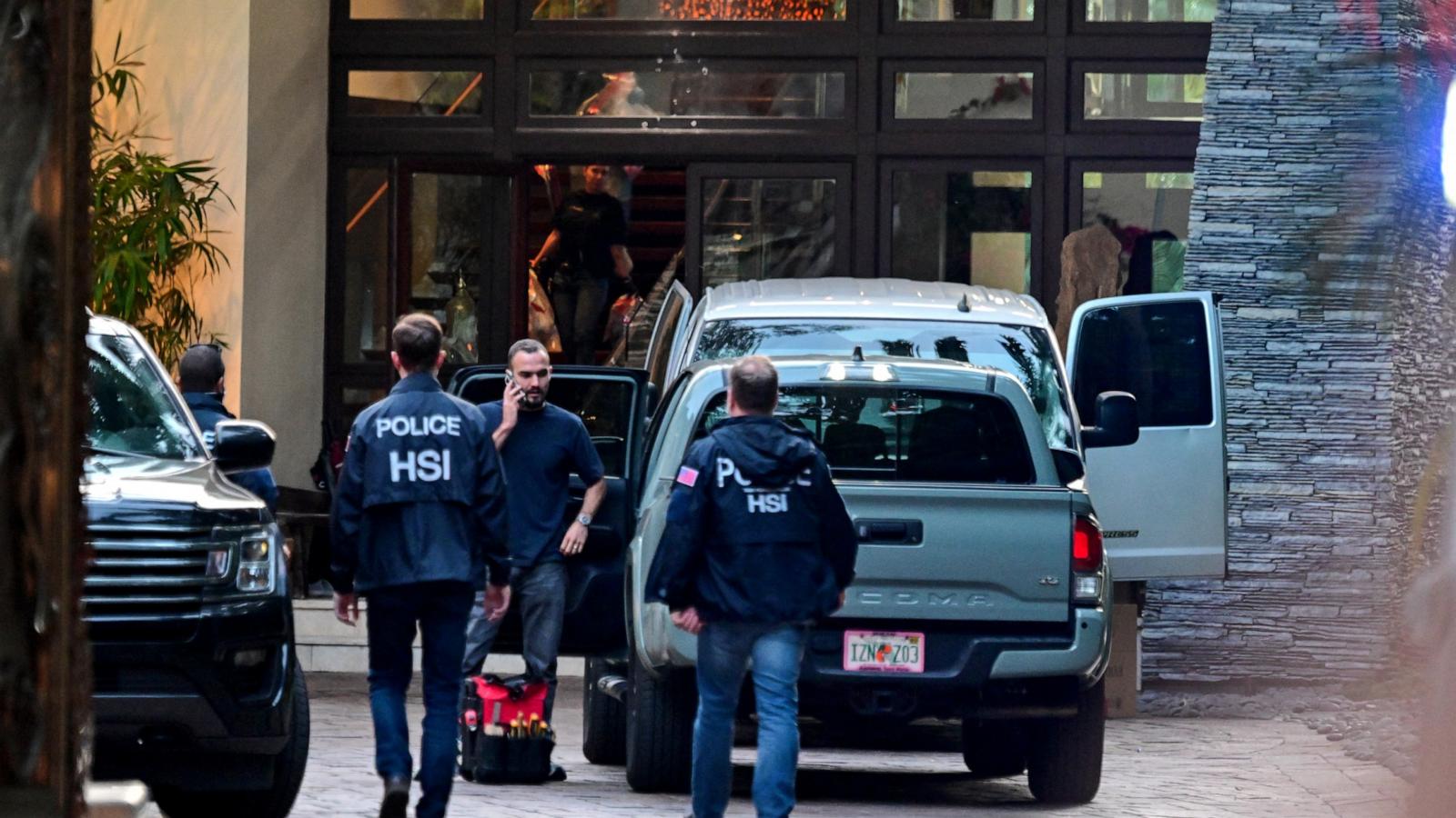 PHOTO: Homeland Security Investigation agents are seen at the entrance of US producer and musician Sean "Diddy" Combs's home at Star Island in Miami Beach on March 25, 2024.