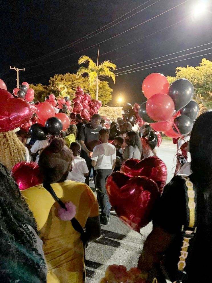 PHOTO: Community members gather for a vigil on Monday Dec. 27 to remember Stanley "SJ" Davis III.