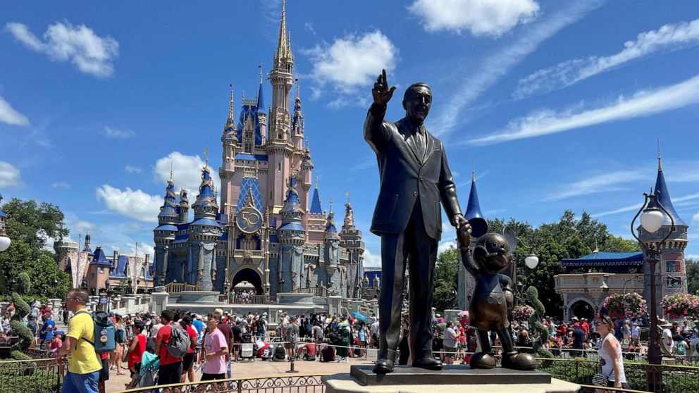 PHOTO: People gather at the Magic Kingdom theme park before the "Festival of Fantasy" parade at Walt Disney World in Orlando, Fla., July 30, 2022.