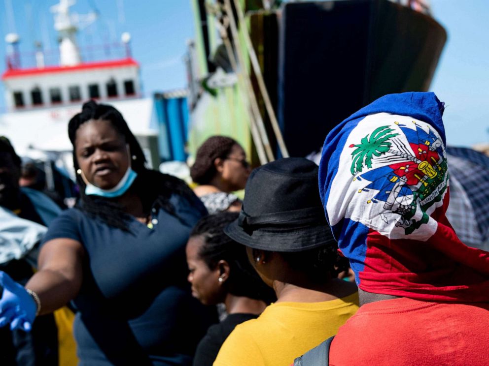 PHOTO: People board a cargo ship for evacuation to Nassau at the port in Marsh Harbour, Great Abaco, Sept. 7, 2019, in the aftermath of Hurricane Dorian.