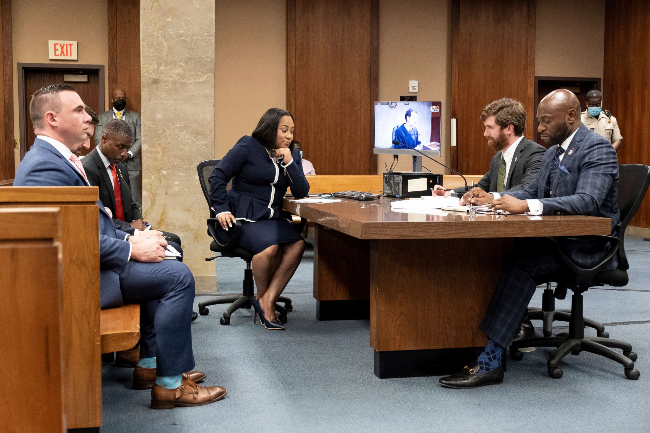 PHOTO: In this May 2, 2022, file photo, Fulton County District Attorney Fani Willis, center, sits with her team during proceedings to seat a special purpose grand jury in Fulton County, Ga.
