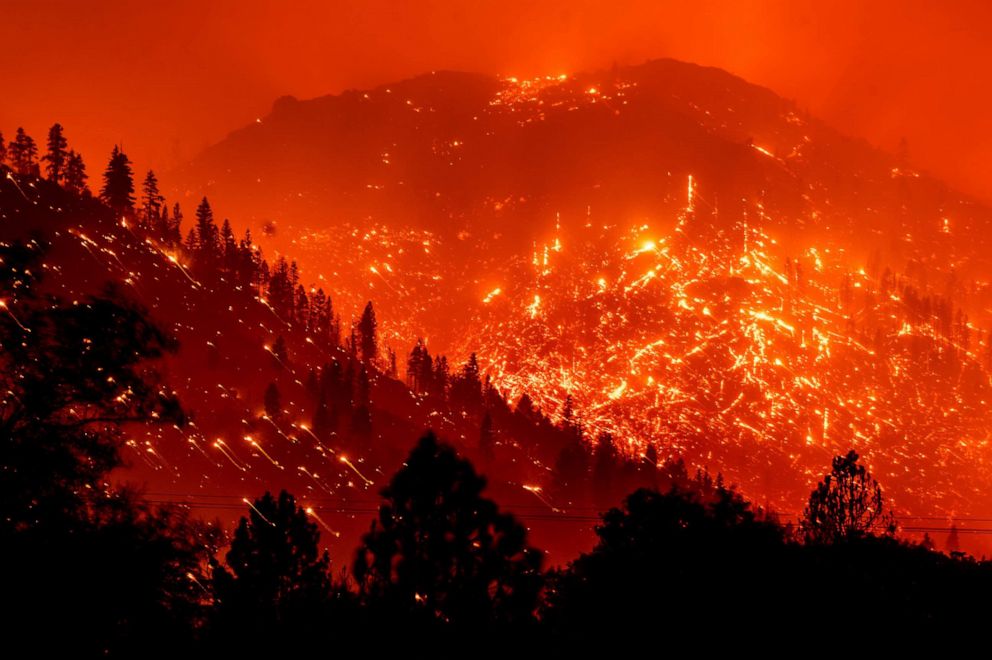PHOTO: Embers light up the hillsides as the Dixie Fire burns near Milford in Lassen County, Calif., on Aug. 17, 2021, in a long exposure photograph.