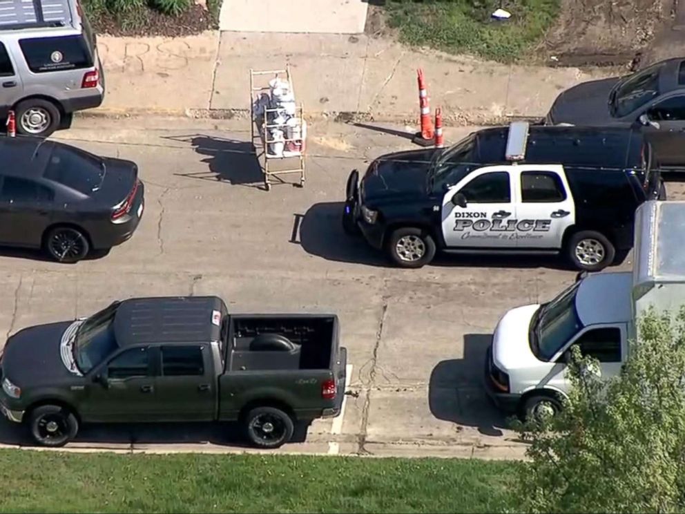 PHOTO: A police car sits in front of Dixon High School in Dixon, Ill., after a police officer confronted and injured an armed man at the school, May 16, 2018.