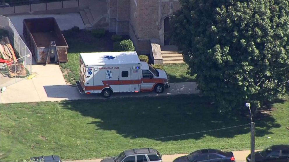 PHOTO: An ambulance sits in front of Dixon High School in Dixon, Ill., after a police officer confronted and injured an armed man at the school, May 16, 2018.