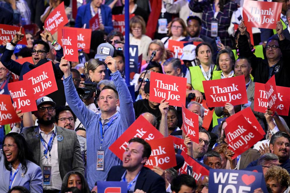 PHOTO: Delegates hold up signs reading "Thank you Joe" as President Joe Biden speaks on the first day of the Democratic National Convention, Chicago, Aug. 19, 2024.