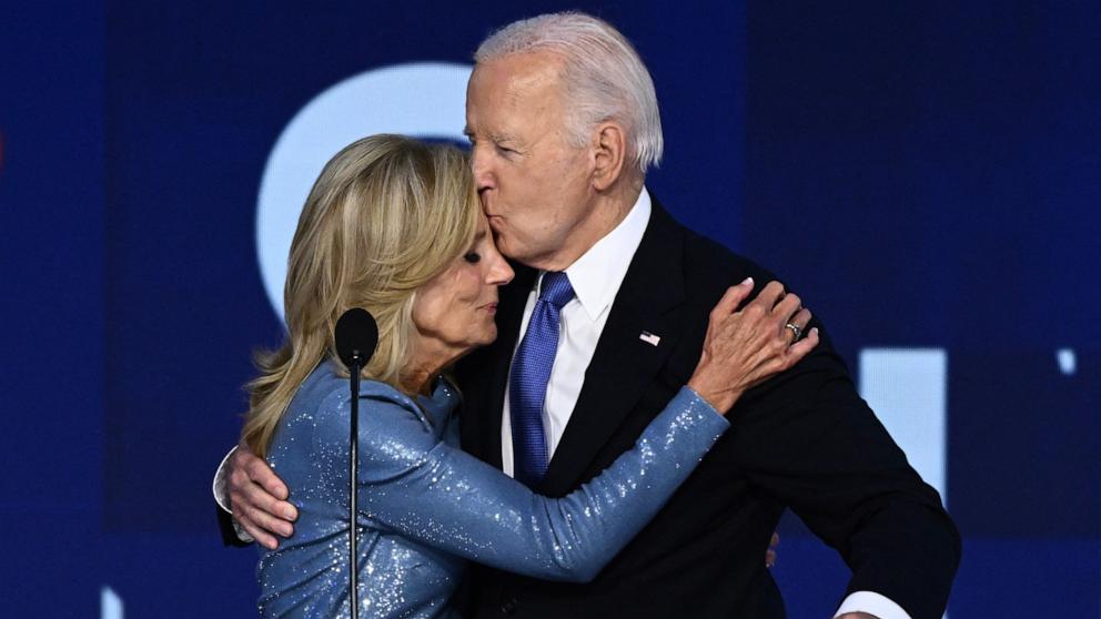 PHOTO: President Joe Biden kisses his wife First Lady Jill Biden after he gave the keynote address on the first day of the Democratic National Convention, in Chicago, Aug. 19, 2024. 