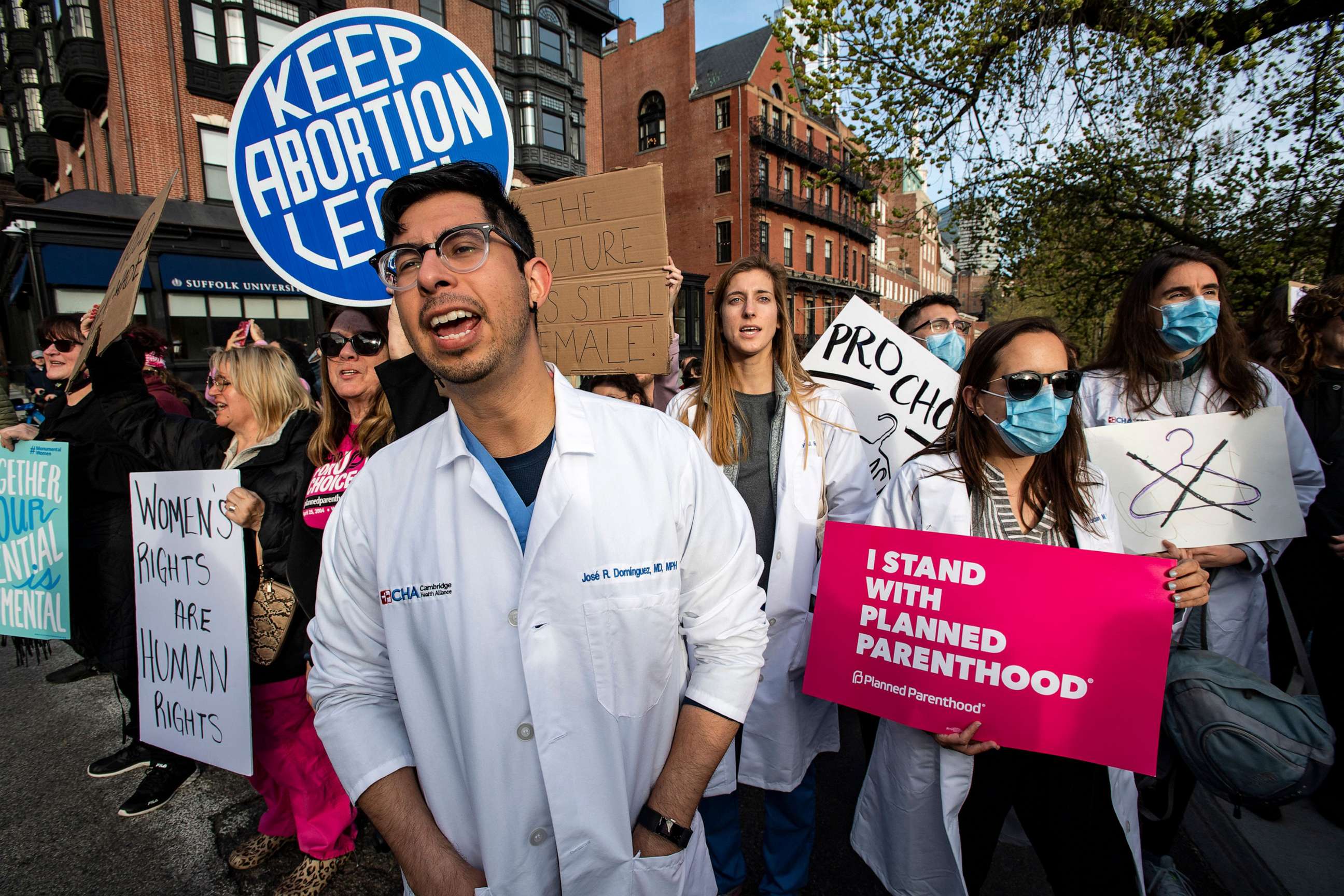 PHOTO: In this May 3, 2022, file photo, a group of doctors and medical workers join protesters gathering in front of the State House to show support and rally for abortion rights in Boston.