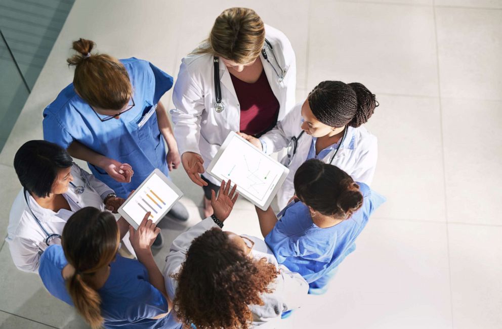 PHOTO: An undated stock photo shows a group of medical practitioners analyzing data in a hospital.