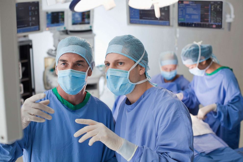 PHOTO: An undated stock photo shows two doctors discussing a patient's results.