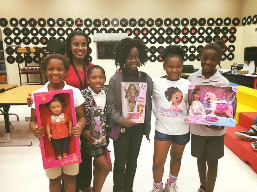PHOTO: Zoe Terry, 11, is photographed here with young girls who have received dolls of color through her nonprofit group "Zoe's Dolls" at one of their giveaway events. 