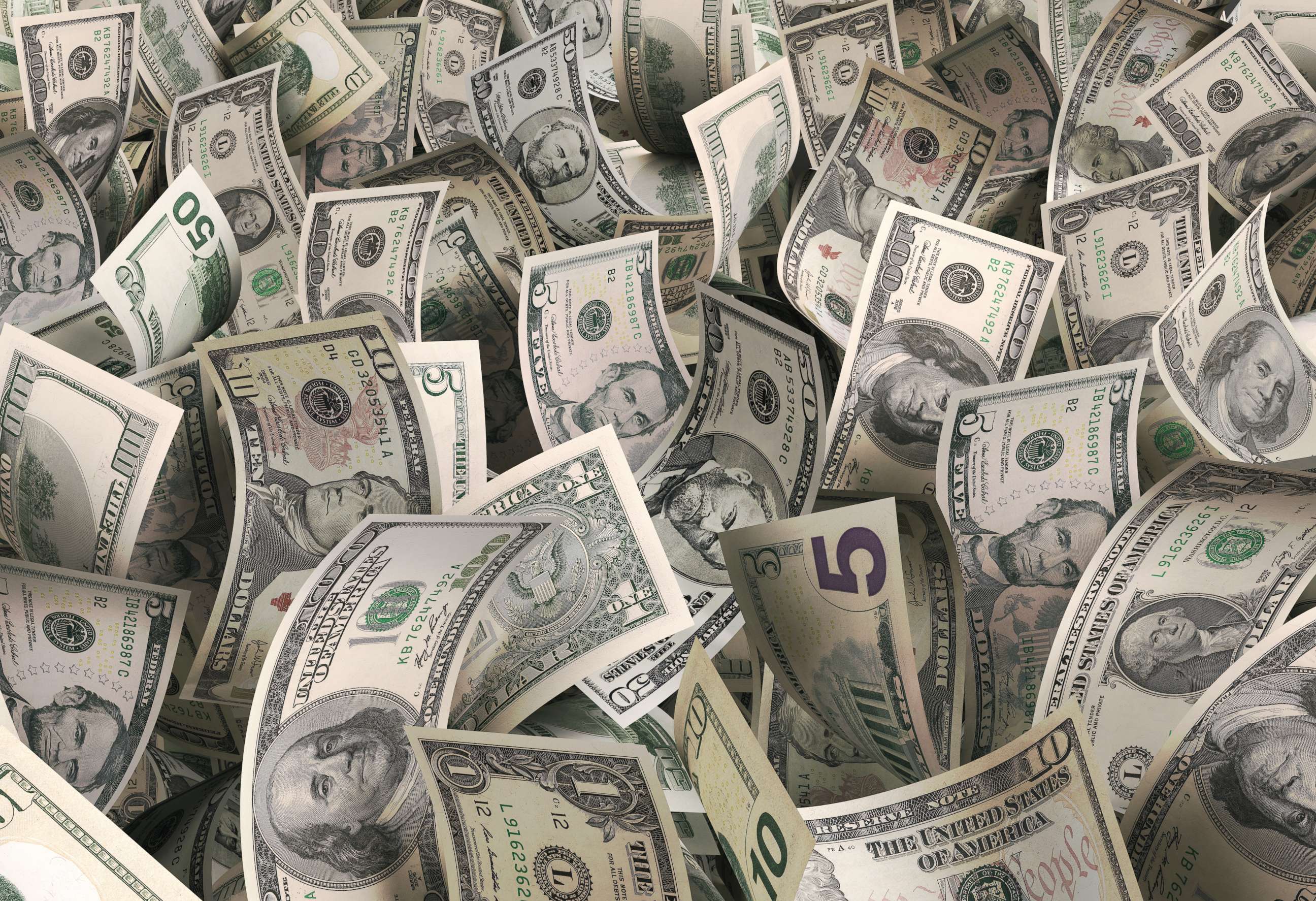 PHOTO: Several notes of U.S. dollars scattered everywhere.