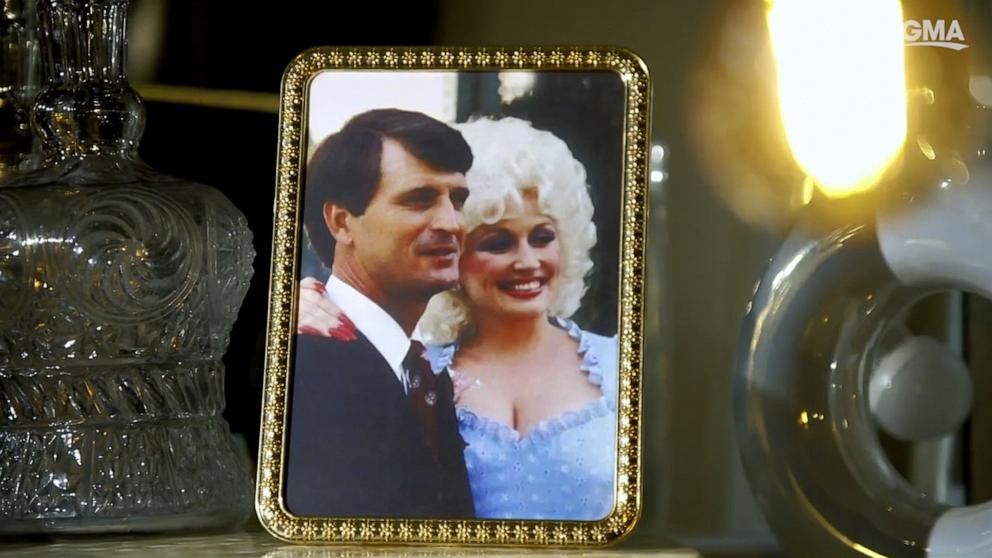 PHOTO: A framed photo of Dolly Parton and her husband Carl Dean stands on a table top while Parton was interviewed by ABC News in Nov. 2023.