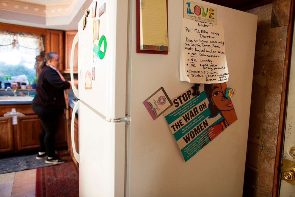 PHOTO: A volunteer prepares food at a shelter for homeless and battered women and their dependent children in Paterson, N.J., Feb. 25, 2021.