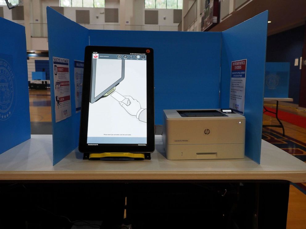 PHOTO: Instructions showing voters where to insert their unique voter card in order to start voting are displayed on this Dominion ballot marking device at a polling place in Georgia, Oct. 26, 2020.