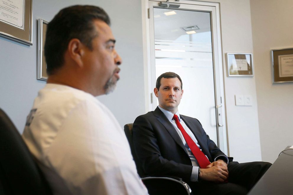 PHOTO: Lawyer Patrick Luff, right, listens to Don Coca, father of Walmart shooting victim Jessica Garcia, talk about the lawsuit filed against Walmart, Sept. 4, 2019, at James Kennedy PLLC in El Paso.
