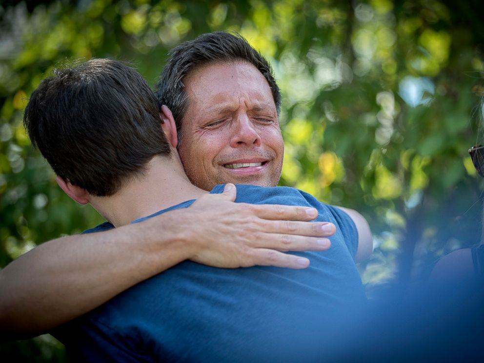 PHOTO: Don Damond is comforted by friends and family after making a statement to the press near his home after a Minneapolis police officer shot and killed his fiance Justine, July 17, 2017, in Minneapolis, Minnesota.