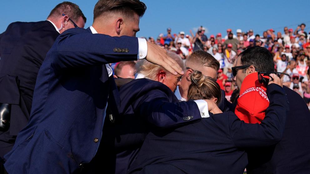 PHOTO: Republican presidential candidate former President Donald Trump is surrounded by U.S. Secret Service agents at a campaign rally, July 13, 2024, in Butler, Pa.