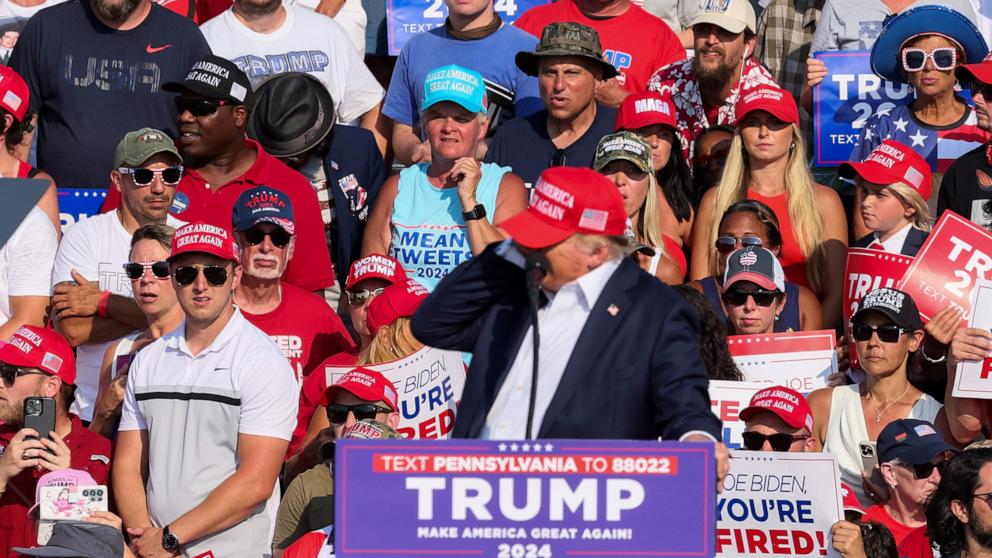 PHOTO: Republican presidential candidate and former U.S. President Donald Trump reacts as multiple shots rang out during a campaign rally in Butler, Pennsylvania, July 13, 2024. 