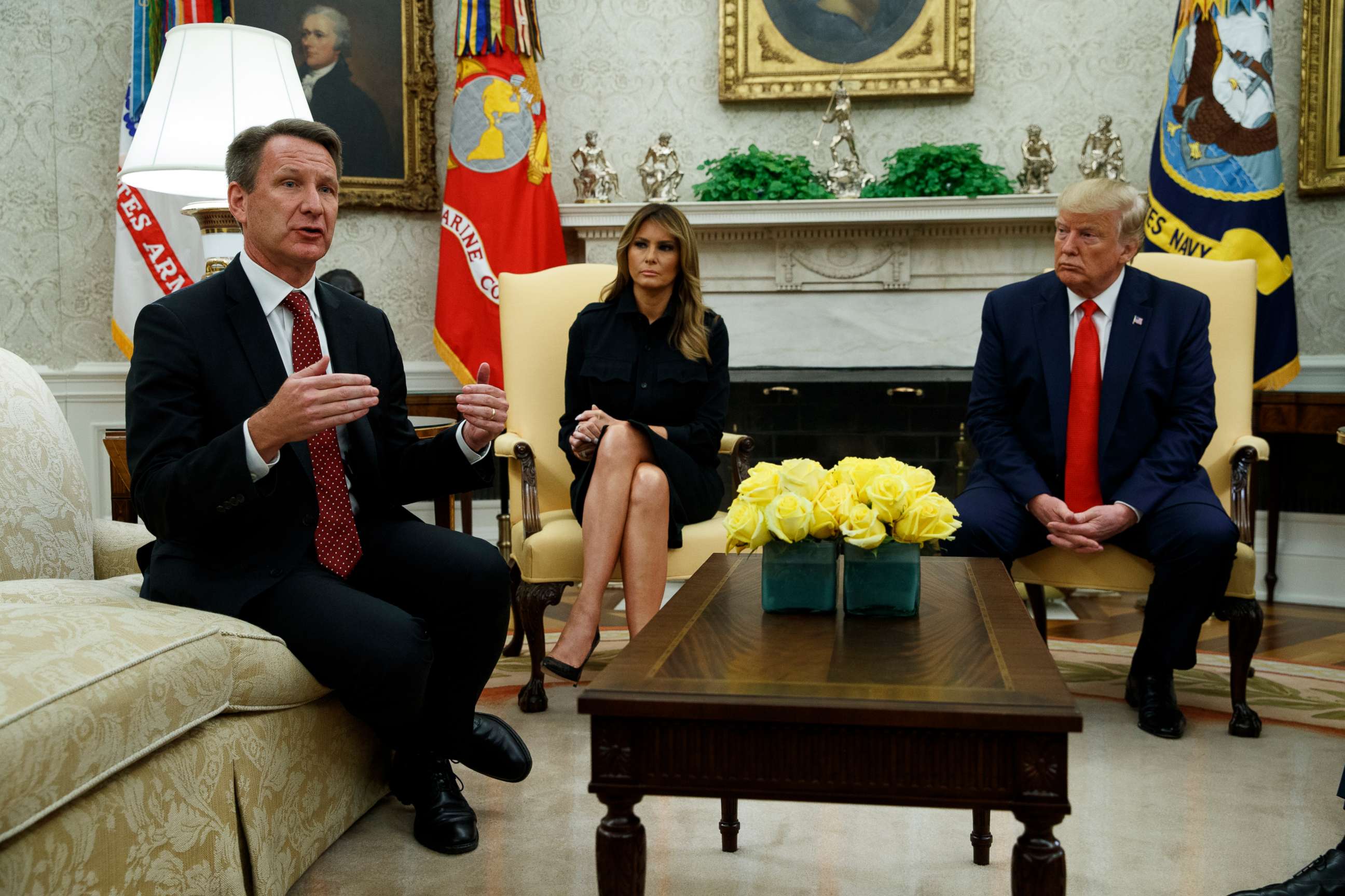 PHOTO: President Donald Trump and first lady Melania Trump listen as acting FDA Commissioner Ned Sharpless talks about a plan to ban most flavored e-cigarettes, in the Oval Office of the White House, Sept. 11, 2019, in Washington.