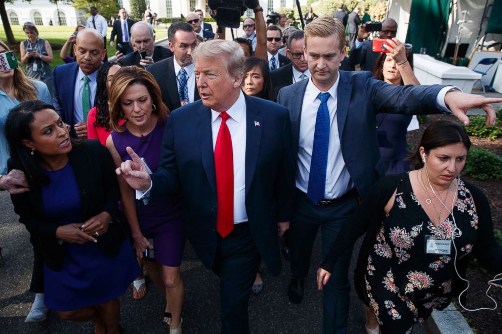 PHOTO: President Donald Trump walks to an interview on the North Lawn of the White House, June 15, 2018, in Washington.