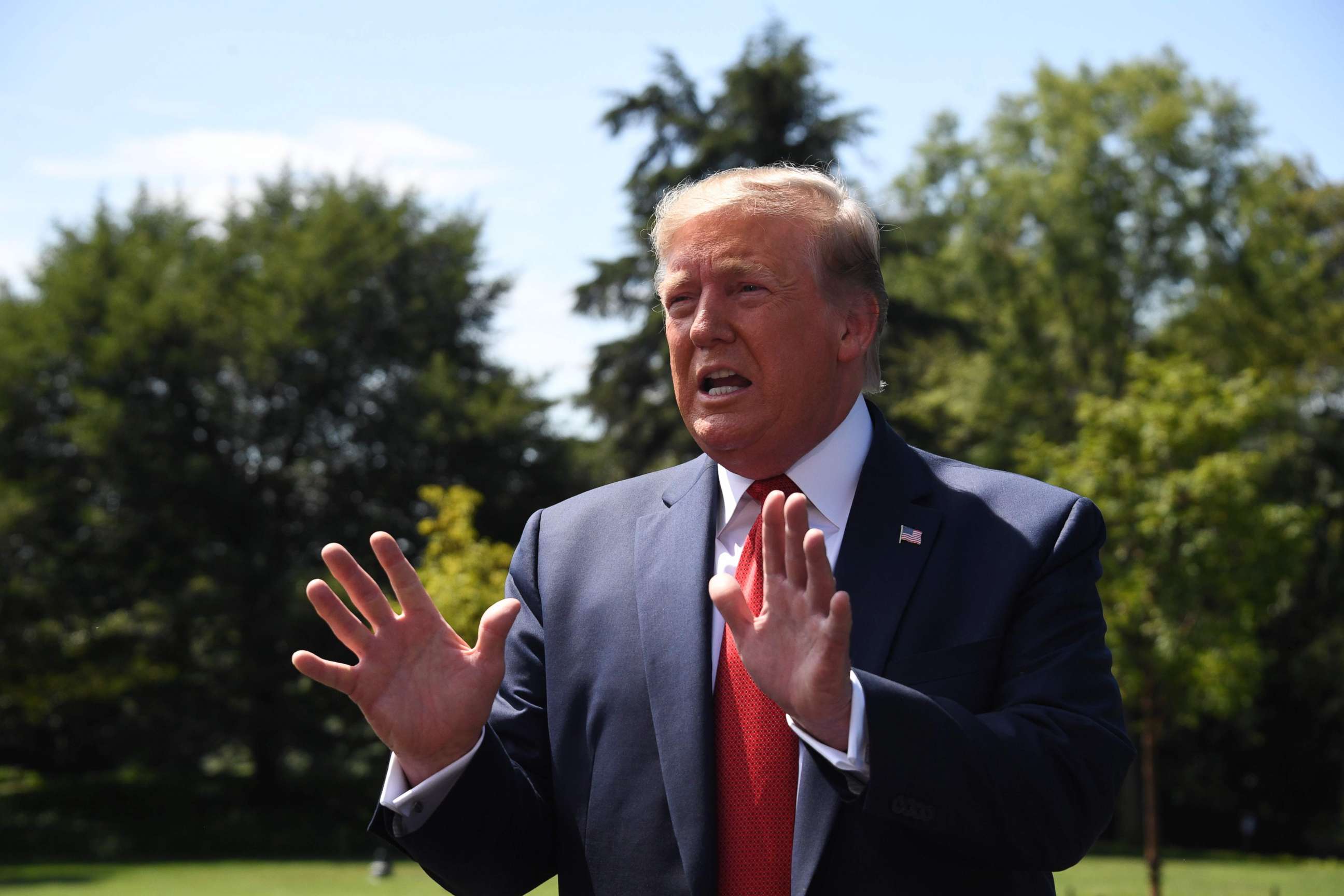 PHOTO: President Donald Trump speaks to the media as he departs the White House in Washington, Aug. 21, 2019.