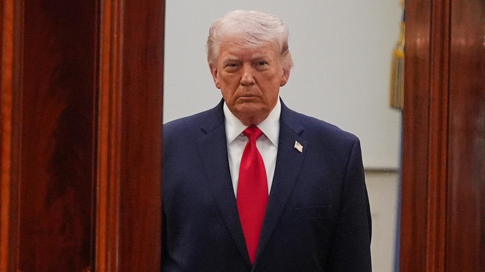 PHOTO: President Donald Trump arrives from the Blue Room to speak about the Iran war from the Cross Hall of the White House, April 1, 2026, in Washington.