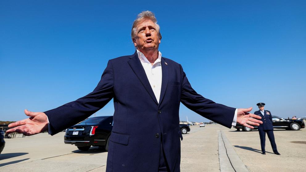 PHOTO: President Donald Trump stops to speak to members of the media as he departs for Texas, at Joint Base Andrews in Maryland, October 27, 2026.