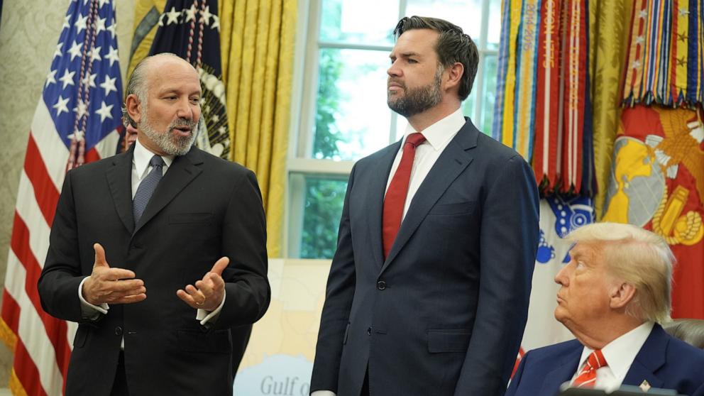 PHOTO: Commerce Secretary Howard Lutnick speaks, as President Donald Trump and Vice President JD Vance listen as a trade deal with United Kingdom in announced in the Oval Office of the White House, May 8, 2025, in Washington.