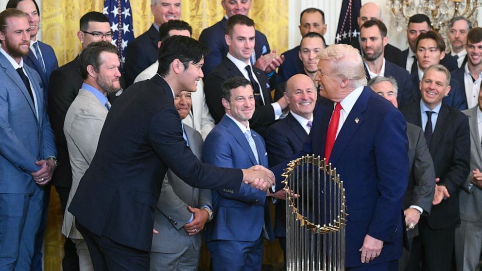 PHOTO: President Donald Trump shakes hans with Shohei Ohtani during an event honoring the 2024 World Series champions Los Angeles Dodgers in the East Room of the White House in Washington, April 7, 2025. 
