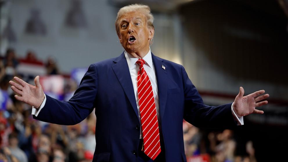 PHOTO: Republican presidential nominee, former U.S. President Donald Trump greets supporters during a campaign event, Oct. 30, 2024, in Rocky Mount, North Carolina. 