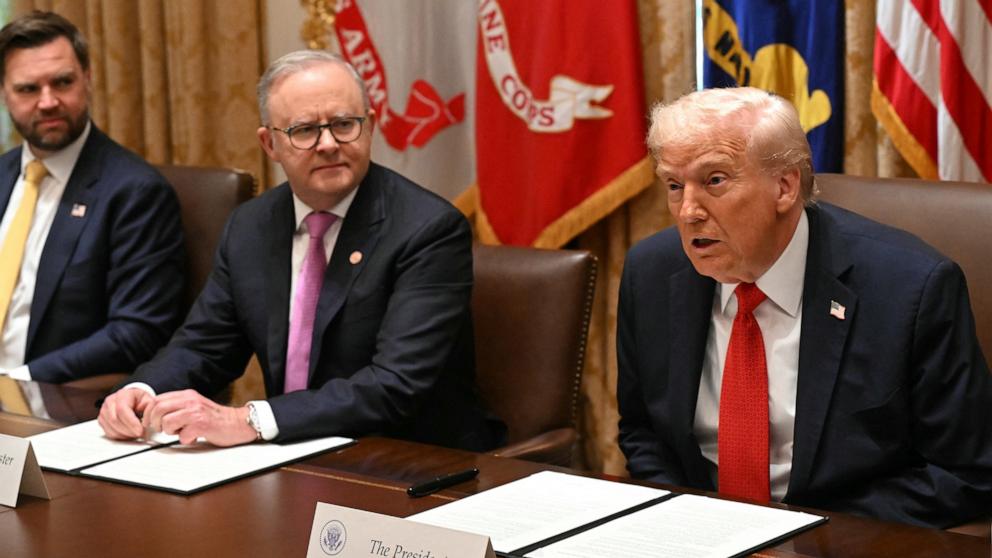 PHOTO: President Donald Trump speaks as he meets with Australia's Prime Minister Anthony Albanese as Vice President JD Vance looks on in the Cabinet Room at the White House in Washington, October 20, 2025. 