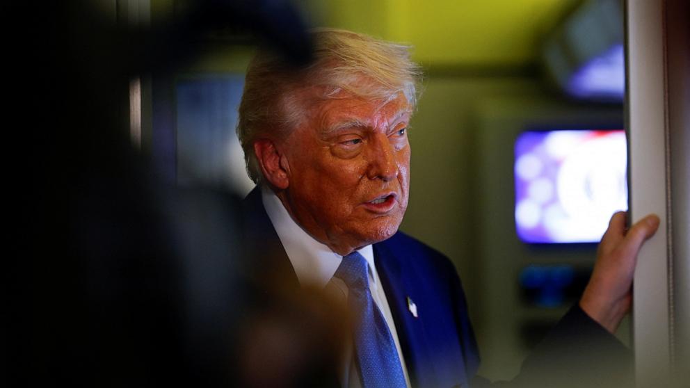 PHOTO: President Donald Trump speaks to members of the media aboard Air Force One, in Abu Dhabi, United Arab Emirates, May 16, 2025.