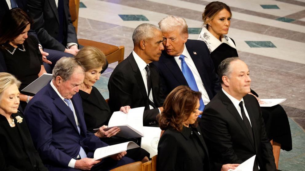 PHOTO: U.S. President-elect Donald Trump speaks with former U.S. President Barack Obama during the state funeral for former U.S. President Jimmy Carter at Washington National Cathedral on Jan. 9, 2025, in Washington.