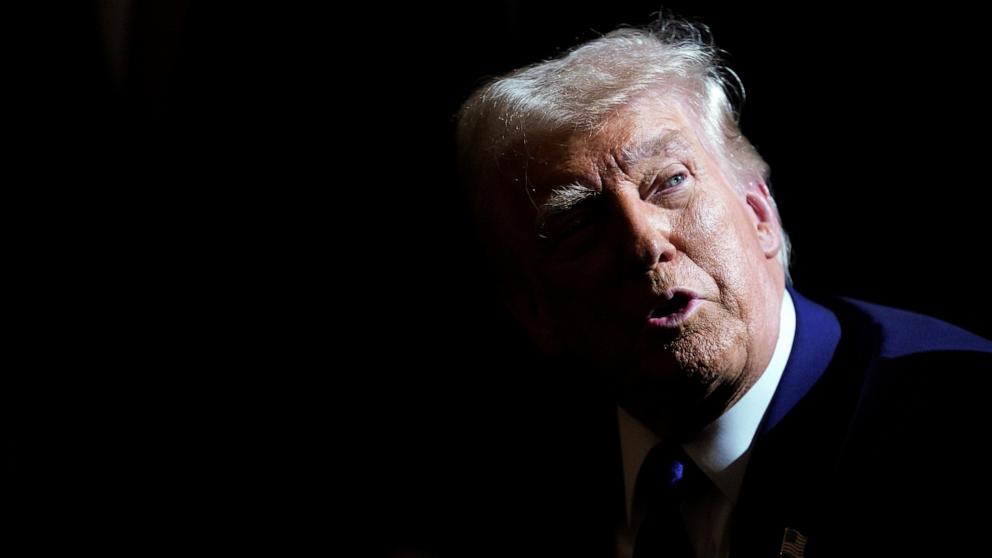 PHOTO: President Donald Trump speaks to reporters as he signs an executive order, in the Oval Office, at the White House in Washington, Feb. 14, 2025. 