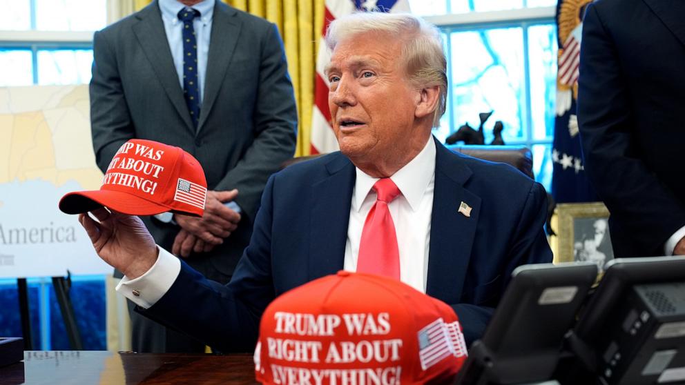PHOTO: President Donald Trump holds a hat reading 'Trump was right about everything' after signing an Executive Order at the Oval Office of the White House in Washington, Feb. 25, 2025.