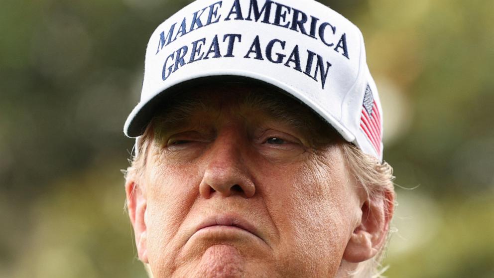 PHOTO: President Donald Trump looks on during the installation of a new flagpole on the South Lawn at the White House in Washington, June 18, 2025.
