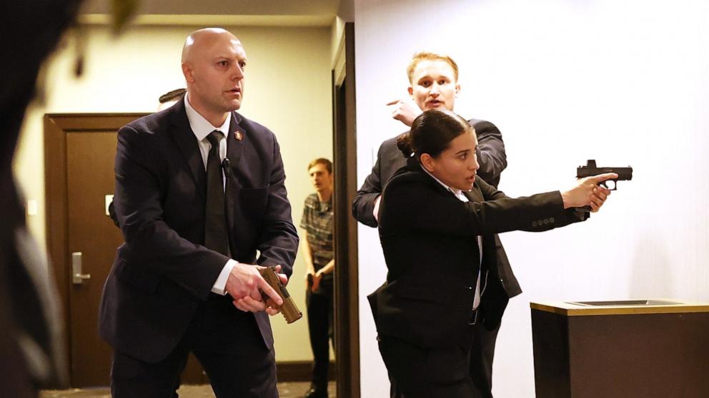 PHOTO: Secret service agents respond during the White House Correspondents Dinner, April 25, 2026, in Washington. 