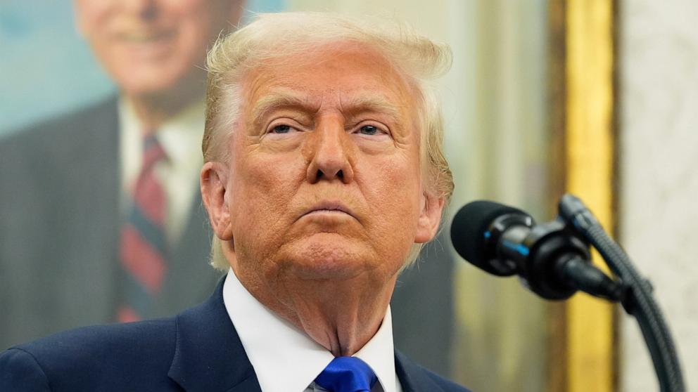 PHOTO: President Donald Trump listens during an event to announce that the 2027 NFL Draft will be held on the National Mall, in the Oval Office of the White House, May 5, 2025, in Washington.
