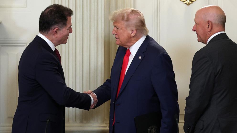 PHOTO: President Donald Trump greets Dell Technologies CEO Michael Dell as they arrive for the Invest America Roundtable in the State Dinning room at the White House, June 9, 2025 in Washington.