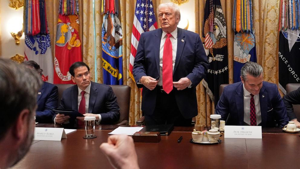 PHOTO: President Donald Trump stands at the end of a cabinet meeting at the White House, Dec. 2, 2025, in Washington.