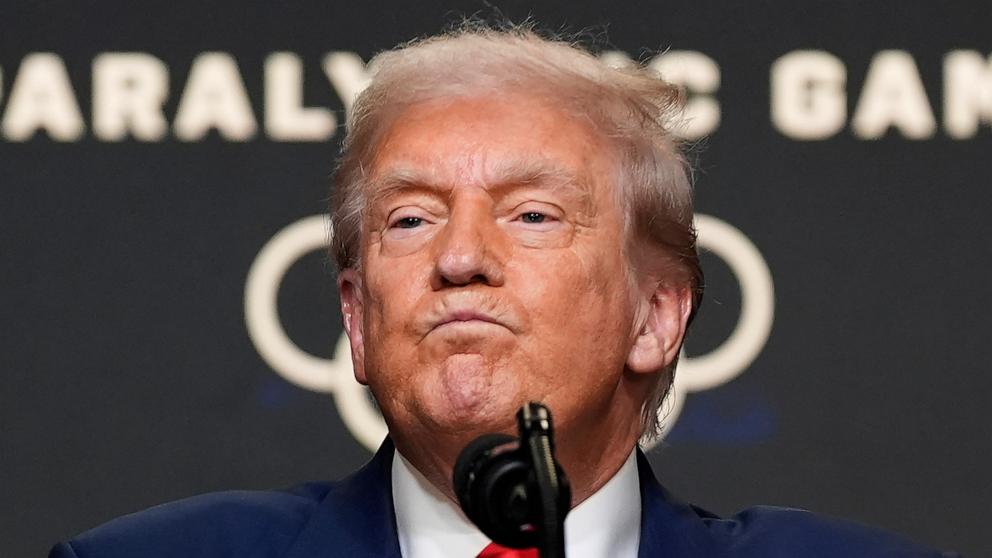 PHOTO: President Donald Trump listens to a question from a reporter after signing an executive order about the 2028 Los Angeles Olympic Games, in the South Court Auditorium of the Eisenhower Executive Office Building, Aug. 5, 2025.